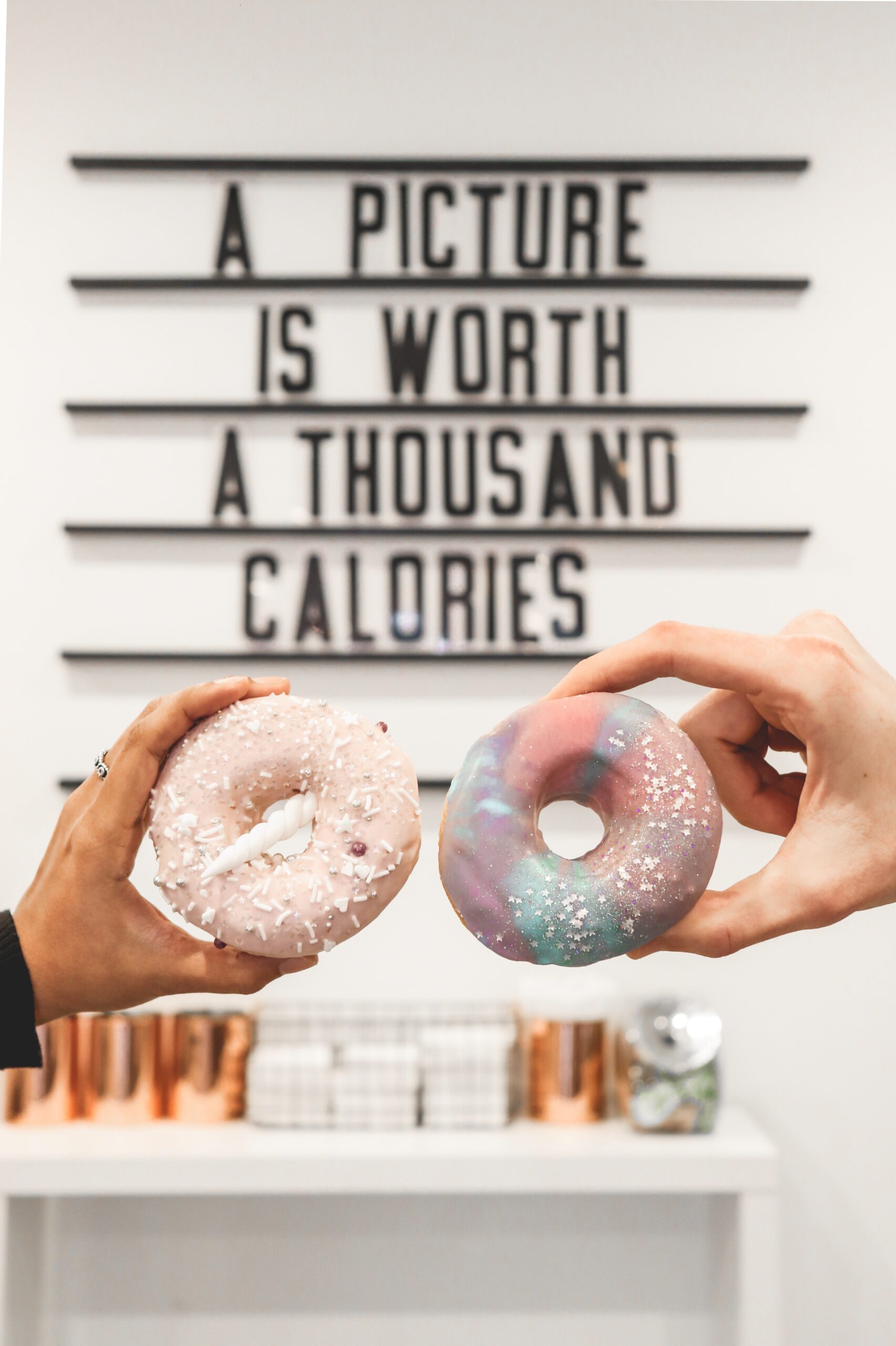 Two doughnuts with text saying "a picture is worth a thousand ca